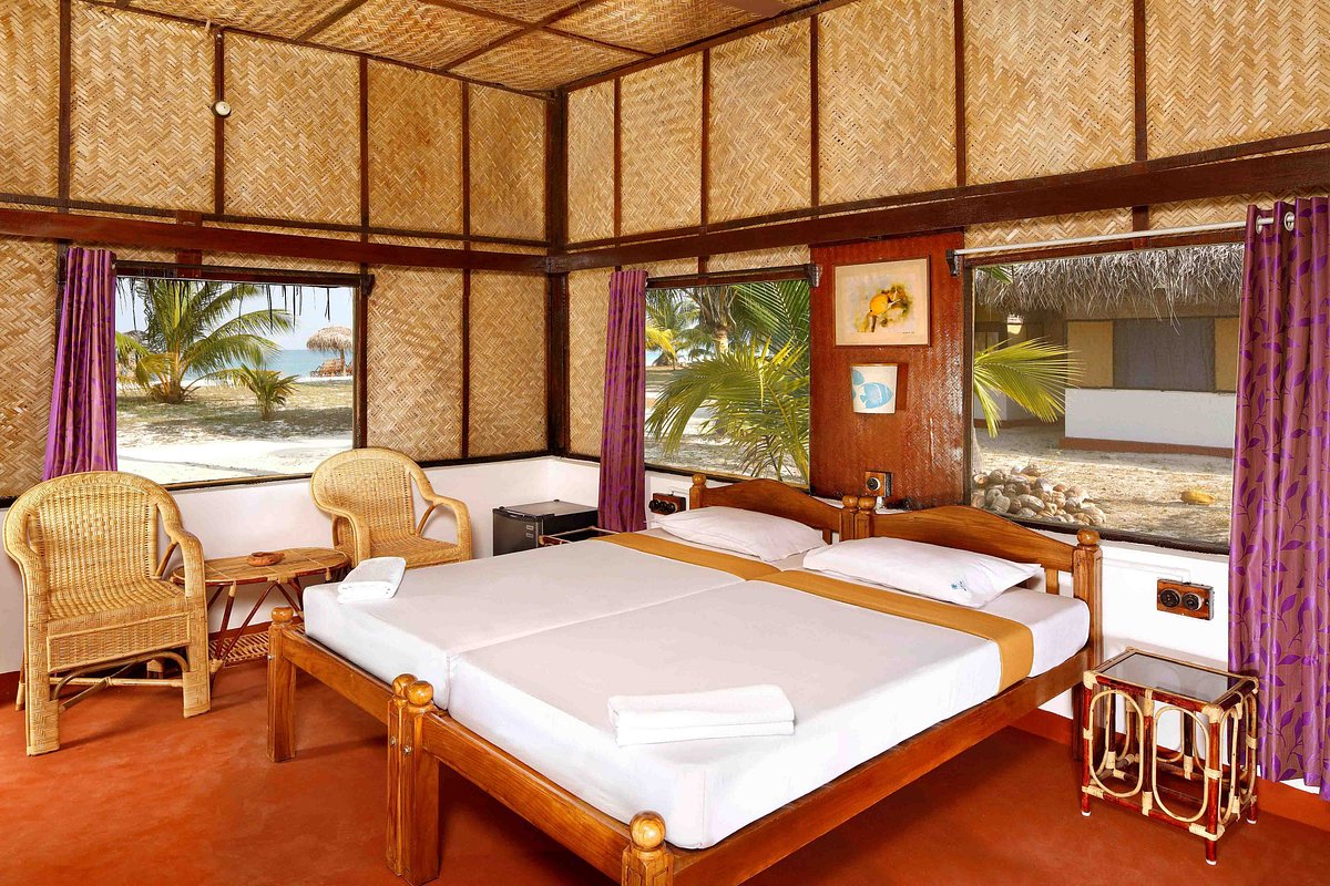 Description: An upscale eco-resort that is the only habitation on the entire island. It features independent AC wooden cottages just steps away from the white sand. The resort offers a "barefoot luxury" experience with no televisions or distractions, focusing instead on the pristine natural surroundings, a premium bar (one of the few in Lakshadweep), and a high-end restaurant serving local Malabar and Continental cuisine.