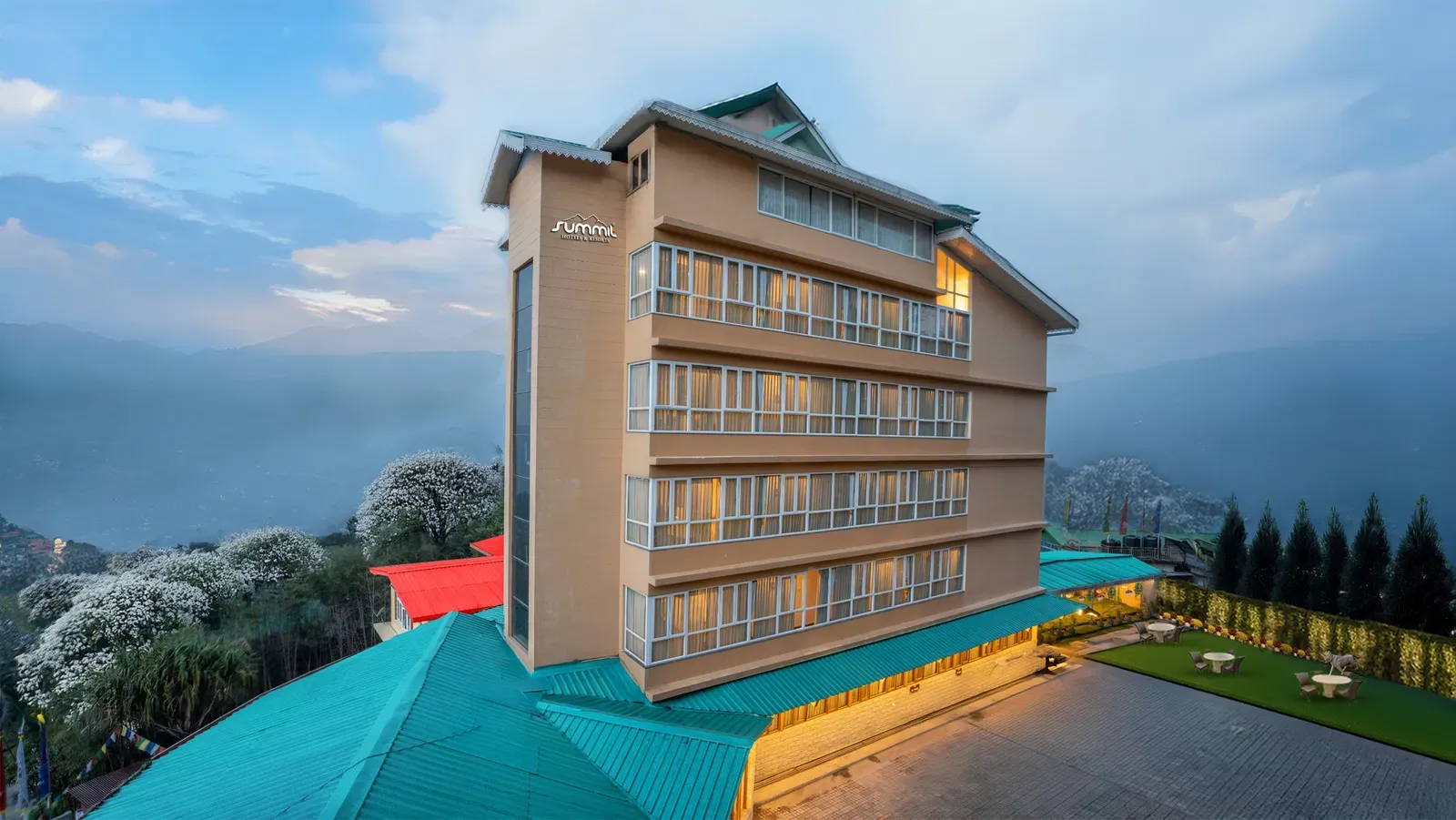 Description: A well-appointed 3-star hotel located near the popular MG Marg. It features cozy rooms with modern amenities and large windows that offer views of the valley. The property includes an in-house spa to relax after your arrival and a multi-cuisine restaurant known for its local Sikkimese dishes and warm hospitality.