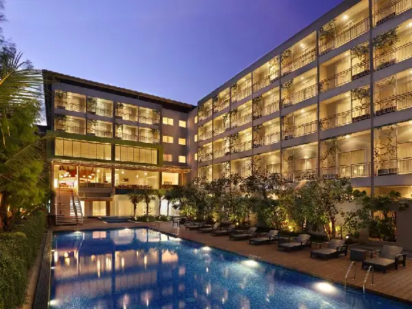 A luxurious boutique resort located in the lush rainforest area of Ubud, Bali, overlooking the beautiful Petanu River valley. The resort features elegant rooms and villas with private balconies, infinity pool views, spa treatments and fine dining restaurants, offering a peaceful and romantic atmosphere perfect for honeymoon couples and nature lovers visiting Bali.