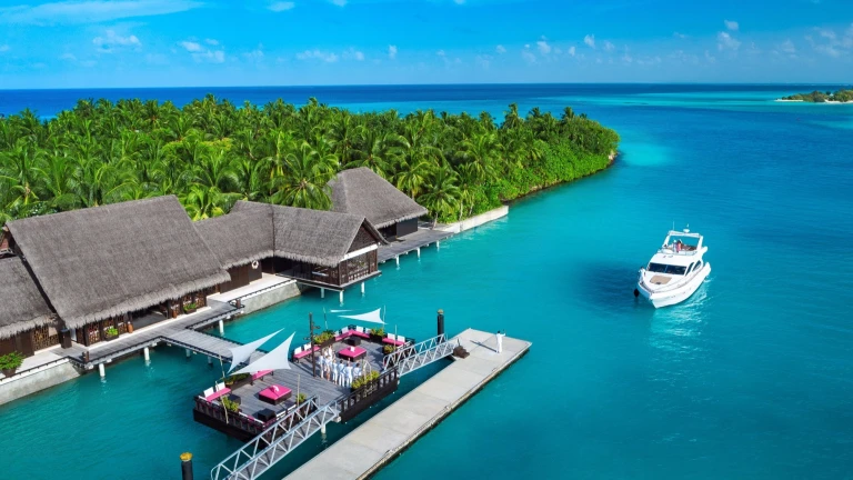 Description: A premier 4-star beachfront resort offering the highest standard of luxury on Agatti Island. The air-conditioned wooden cottages are designed with elegant interiors and private balconies that open directly onto the white sandy beach. The property features an expansive lagoon-view restaurant, personalized butler service, and a professional diving center. Its location is ideal for sunset viewing and immediate access to the island's best snorkeling spots.