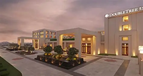 Description: For your final day, this upscale 5-star hotel provides a stylish and comfortable base near the Taj Nature Walk. It features a rooftop infinity pool with stunning views of the Taj Mahal, a state-of-the-art fitness center, and a multi-cuisine restaurant, North 27. Its proximity to the main shopping areas like Sadar Bazaar makes it ideal for last-minute souvenir hunting before your departure.