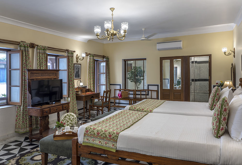Description: Built in 1920, this elegant 4-star heritage mansion offers an authentic glimpse into Jodhpur's aristocratic past. The property features beautifully appointed rooms with traditional Rajasthani decor, private courtyards, and an inviting outdoor swimming pool. Located away from the city's noise yet centrally positioned, it provides a tranquil atmosphere and a highly-regarded in-house restaurant serving traditional Marwari cuisine.