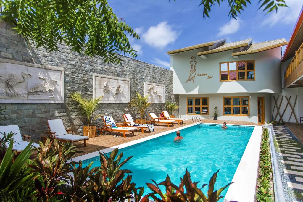 Kaani Village & Spa is a charming resort with tropical-style rooms and modern amenities. Perfect for couples looking for beachside relaxation and cultural immersion.

Facilities: Swimming pool, spa, restaurant, bar, Wi-Fi, air-conditioned rooms
