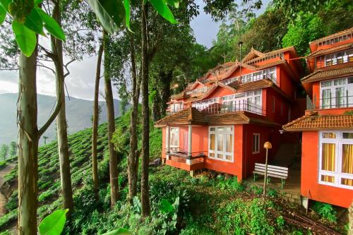 A boutique 4-star property set inside a 6.5-acre tea estate. Rooms are colonial-style cottages with private decks that open directly into the tea bushes.