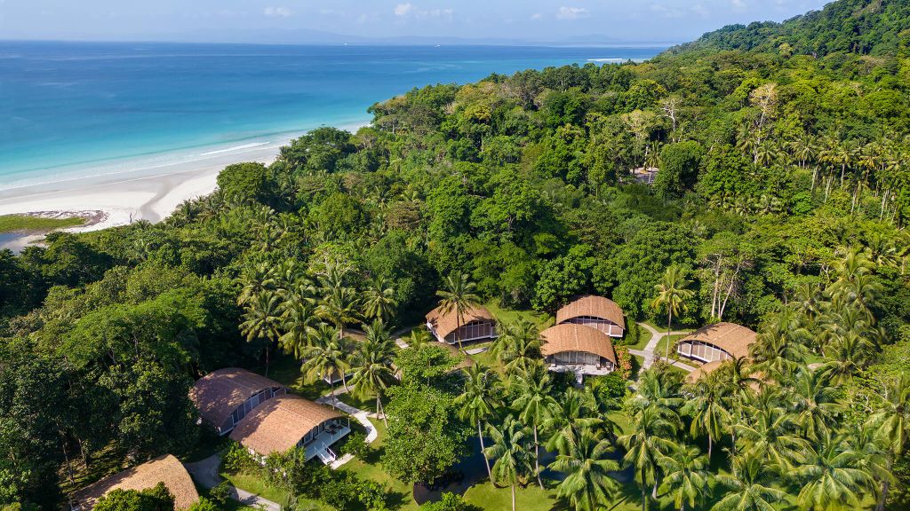 Spanning 46 acres on Radhanagar Beach, this is the most luxurious hotel in the Andamans. You will stay in a Deluxe Luxury Villa (1500+ sq. ft.) inspired by the huts of the Jarawa tribe, featuring sustainable luxury and private sit-outs.